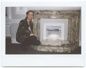 andrea-keeley-photo-beside-the-fireplace-with-a-photograph-frame