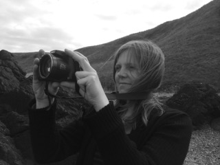 photo-of-jayne-stokes-holding-a-camera-black-and-white