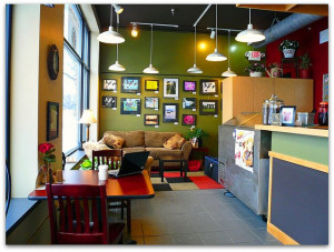 cafe-gallery-green-walls-with-frame-painting-on-the-wall-warm-lighting