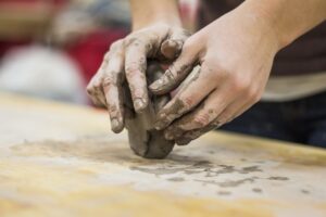 close-up-of-hands-of-a-potter-ceramics-clay