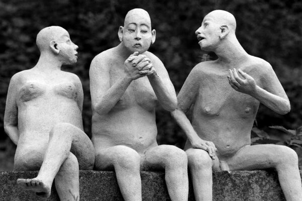 nude-sculptures-of-three-bald-men-black-and-white