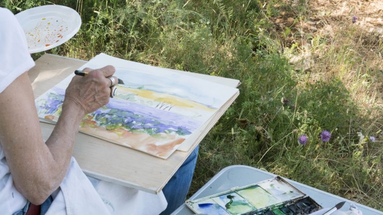 Women watercolor painting en plein air outdoors