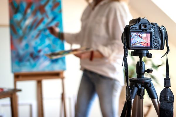 female-artist-recording-her-video-tutorial-about-art-painting.-freelance-woman-sharing-online-her-job