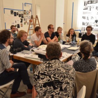 alternative art schools - artists having a discussion - inside a room