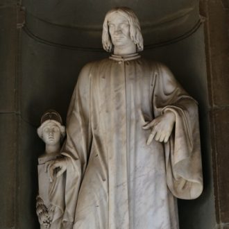 Statue-of-Lorenzo-the-Magnificent-Among-the-Streets-in-Florence-Tuscany-Italy-cropped