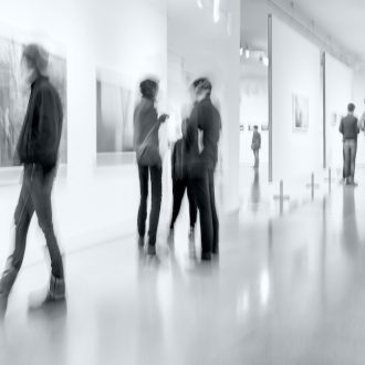 people in the art gallery center in monochrome blue tonality