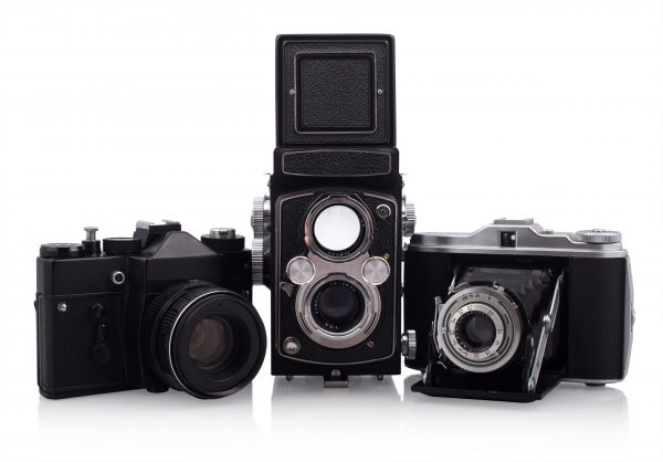 Three-old-cameras-on-white-background