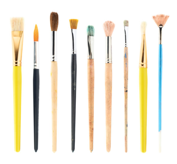 Set of multiple used and new drawing brushes isolated over the white background
