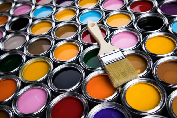 Tins of household paint in an array of colours