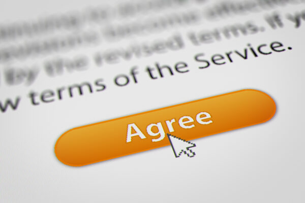 Mouse cursor hovering over website's terms of service Agree button