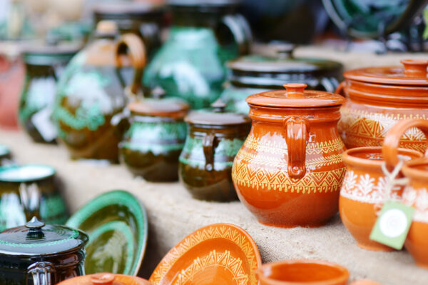 Ceramic pottery jars on display at an open holiday market