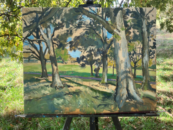 en plein air painting of trees and green background that camoflauges into the real background