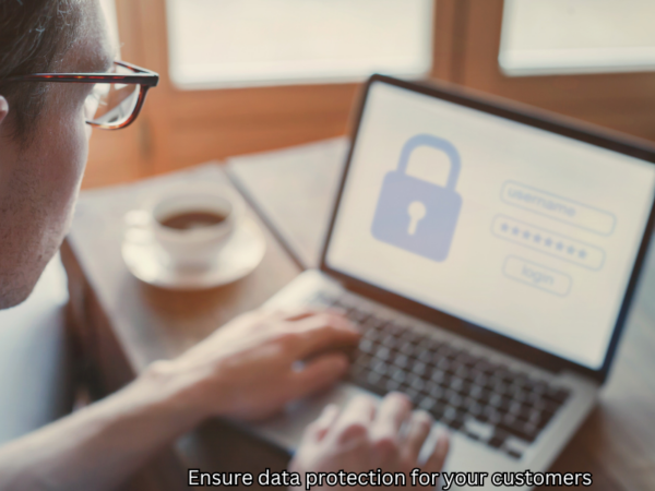 Man looking at laptop with secure screen showing an image of a lock